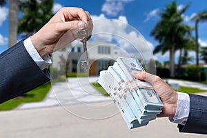 Man Handing a man Thousands of Dollars For Keys in Front of House.