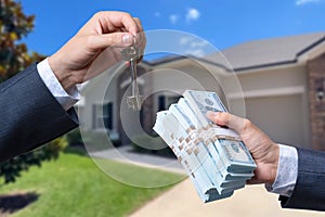 Man Handing a man Thousands of Dollars For Keys in Front of House.