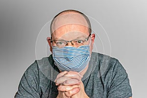Man in a handmade medical mask. Lack of masks