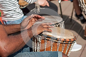 man hands on african drums in outdoor
