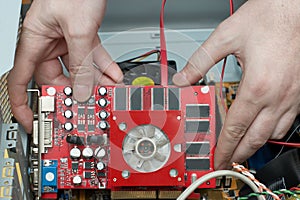 Man hands assembles video card