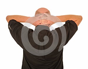 Man with hands behind head