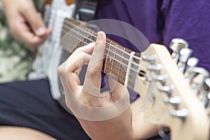 Man hands closeup play the guitar