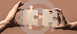 Man hands connecting couple puzzle piece. Business solutions, target, success, goals and strategy concepts