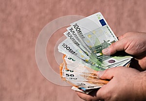 Man hands counting money, counting EURO currency, close up