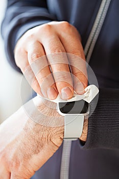 Man hands disinfecting smart watch, eliminating germs coronavirus bacteria