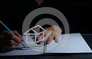 man hands drawing on notebook with ruler plan for own house architecture engineer