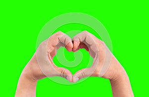 Man hands in the form of heart against the chroma key green screen background, hands in shape of love