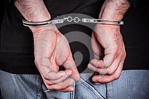 Man hands in handcuffs