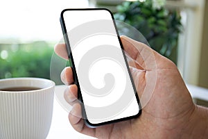 man hands hold phone with isolated screen on background cafe