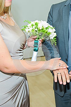 Man hands hold ring for wedding ceremony