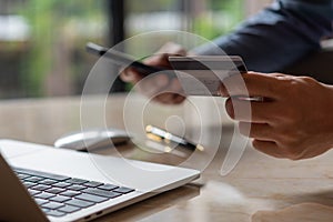 man hands holding credit card using internet payment laptop computer, online shopping digital banking, Business financial