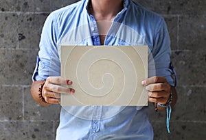 Man hands holding empty signboard