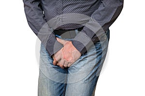 Man with hands holding his crotch, he wants to pee, incontinence photo