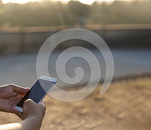 Man hands holding mobile phone outdoor surfing internet online technology lifestyle. Man close up hand using smartphone gadget