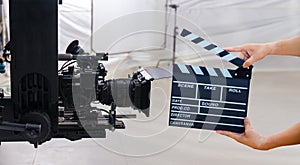 Man hands holding movie clapper. Film director concept. Behind the scenes of movie shooting or video production and film crew team