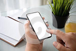 Man hands holding phone with screen in office