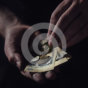 Man hands holding USSR rubles, money on a black background, close-