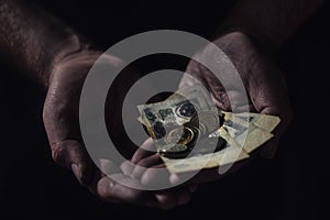 Man hands holding USSR rubles, money on a black background, close-