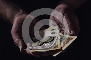 Man hands holding USSR rubles, money on a black background, close-