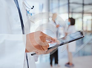 Man hands of hospital doctor with tablet to search through digital medicine clinic medical records, files or documents