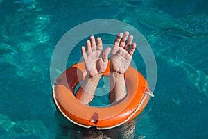 Man hands and lifebuoy in water. Drowning and rescue service con