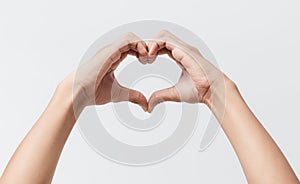 Man hands making a heart shape on a white  background