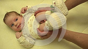 Man Hands Massaging Newborn Baby Body. Closeup. 4K UltraHD, UHD