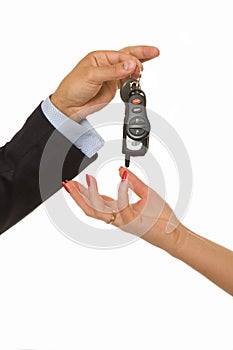 Man hands over a bunch of car keys and car alarm