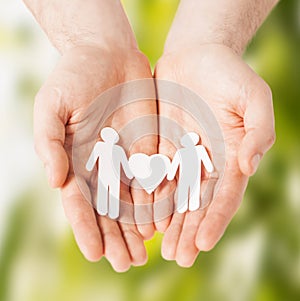 Man hands with paper men