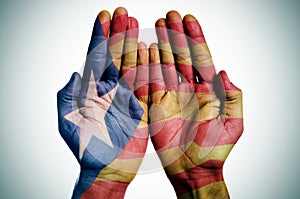 Man hands patterned with the Catalan pro-independence flag