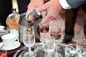 Man hands pouring drink