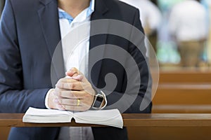 Man hands praying on a holy bible in church for faith concept, Spirituality and Christian religion