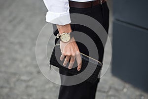 Man hands with purse. Close up. Money concept