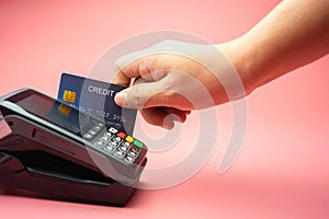 Man Hands swiping Credit card on Credit card machine or Credit card Terminal, Finance concept