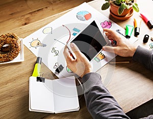 Man hands touching digital tablet. Wooden table with office supp