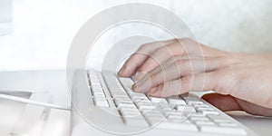 Man hands typing on computer keyboard, business man working on pc in office. Close-up