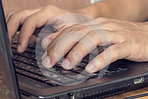Man hands typing on laptop photo