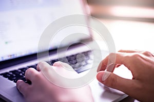 Man hands using laptop on desk