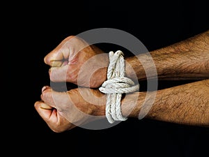 Man hands were tied with a rope. Violence, Terrified, Human Rights Day concept.