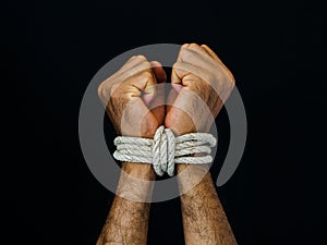 Man hands were tied with a rope. Violence, Terrified, Human Rights Day concept.