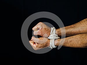 Man hands were tied with a rope. Violence, Terrified, Human Rights Day concept.