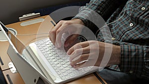 Man hands working on laptop.