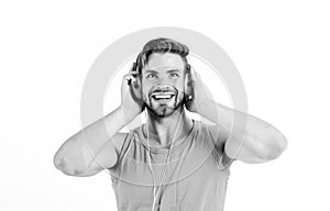 Man handsome bearded guy listening music headphones white background. Audiovisual spectacular. Melody put over various