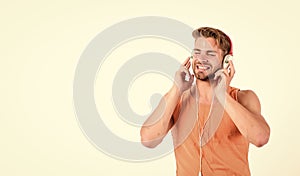 Man handsome bearded guy listening music headphones white background. Melody put over various types of music. It is