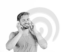 Man handsome bearded guy listening music headphones white background. Music fan concept. Audiovisual spectacular. Melody