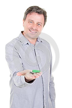 Man handsome businessman hand over keys with isolated white background