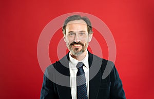 Man handsome mature fashion model wear fashionable suit on red background. Suit imbue sense of confidence of gentlemen