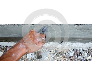 Man haping the edge in om the floor with trowel in construction