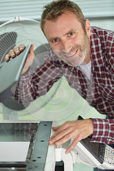 man happy after fixing printing machine